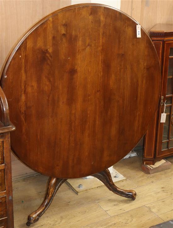 A George III style mahogany circular tilt top breakfast table (the base wormed) Diameter 102cm